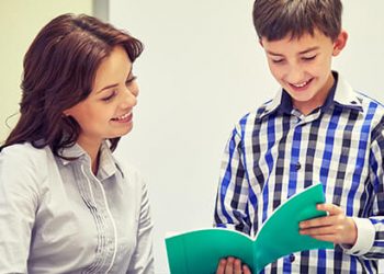 Student reading to his teacher